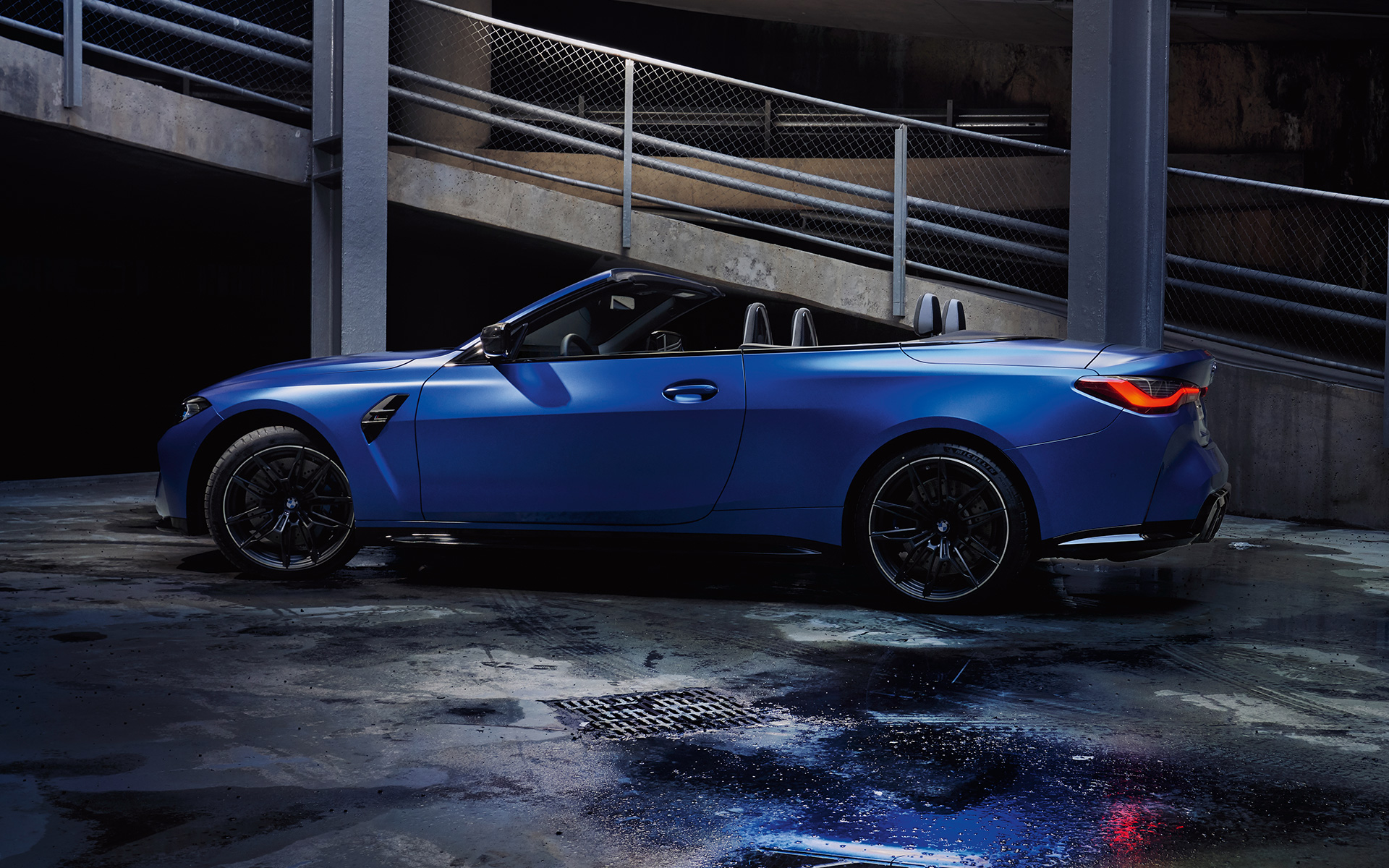 BMW M4 Competition Convertible with M xDrive G83 2021 Frozen Portimao Blue metallic side view with open softtop