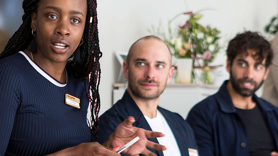 BMW Special Sales Sustainability Hub Social Diversity Close up woman and two men with dark clothes 